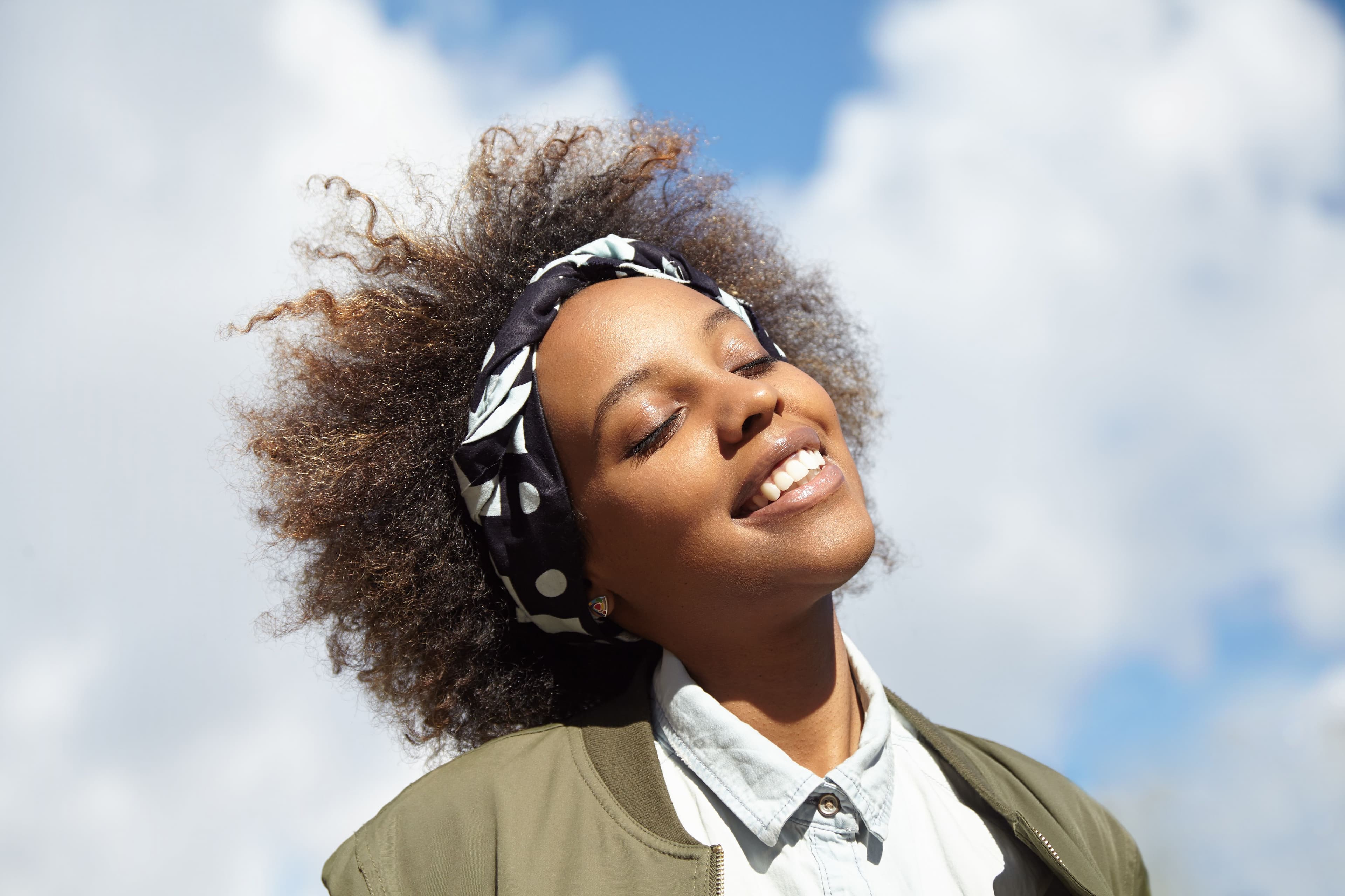 young-woman-with-curly-hair-wearing-bandana