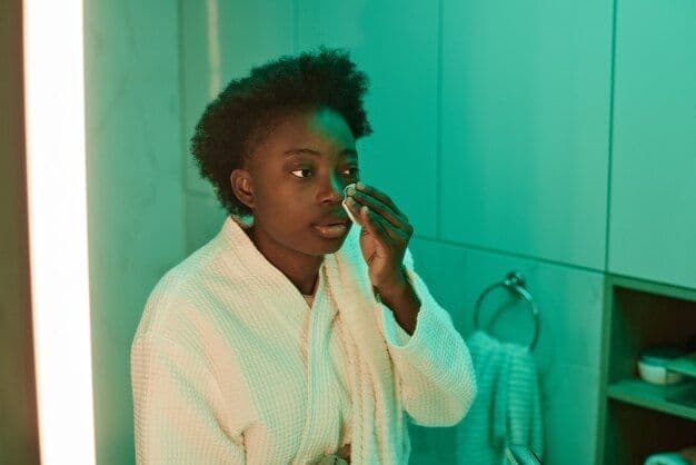 Black woman removing her makeup